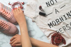 Hands in frame with fashion items