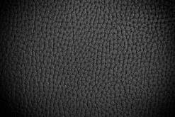 Leather texture containing leather, black, and background