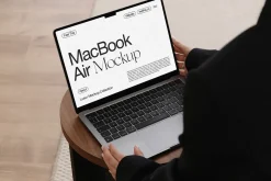 MacBook with Hands Mockup PSD