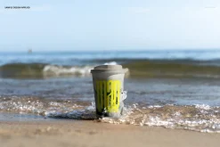 Paper Coffee Cup on the Beach Mockup