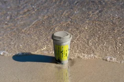 Paper Coffee Cup on the Beach Mockup